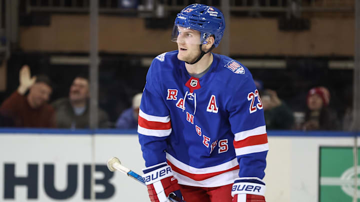 Apr 2, 2026; New York, New York, USA;  New York Rangers defenseman Adam Fox (23) skates over to his bench after scoring a goal in the third period against the Montréal Canadiens at Madison Square Garden. 