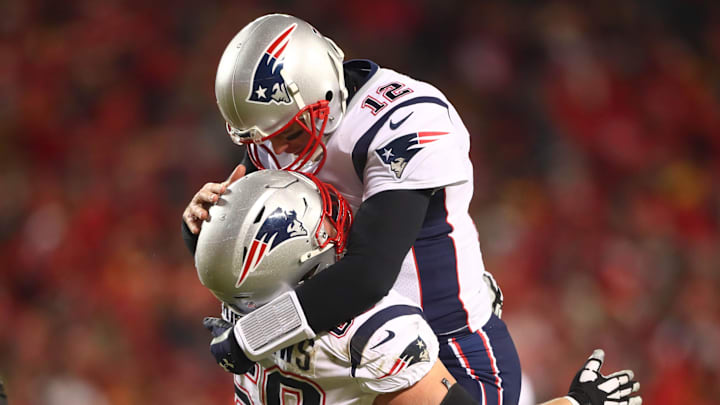 Jan 20, 2019; Kansas City, MO, USA; New England Patriots quarterback Tom Brady (12) celebrates a touchdown with center David Andrews (60) during the first half of the AFC Championship game against the Kansas City Chiefs at Arrowhead Stadium. Mandatory Credit: Mark Rebilas-Imagn Images