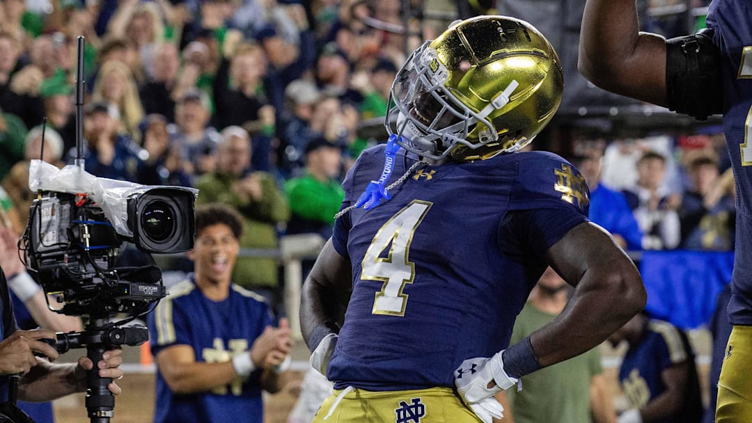 Oct 18, 2025; South Bend, Indiana, USA; Notre Dame Fighting Irish running back Jeremiyah Love (4) celebrates his  touchdown in the first half against the Southern California Trojans at Notre Dame Stadium. Mandatory Credit: Trevor Ruszkowski-Imagn Images