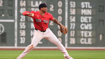 Aug 23, 2024; Boston, Massachusetts, USA; Boston Red Sox third baseman Rafael Devers (11) makes a throw for an out to end the first inning against the Arizona Diamondbacks at Fenway Park. Mandatory Credit: Eric Canha-Imagn Images