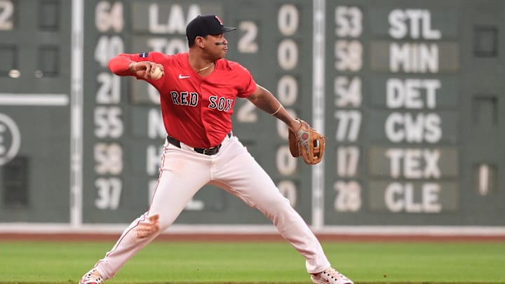 Aug 23, 2024; Boston, Massachusetts, USA; Boston Red Sox third baseman Rafael Devers (11) makes a throw for an out to end the first inning against the Arizona Diamondbacks at Fenway Park. Mandatory Credit: Eric Canha-Imagn Images