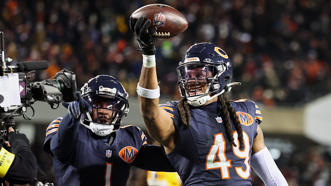 Dec 20, 2025; Chicago, Illinois, USA; Chicago Bears linebacker Tremaine Edmunds (49) poses for a television camera with cornerback Jaylon Johnson (1) after recovering a fumble against the Green Bay Packers during the third quarter at Soldier Field. Mandatory Credit: Mike Dinovo-Imagn Images