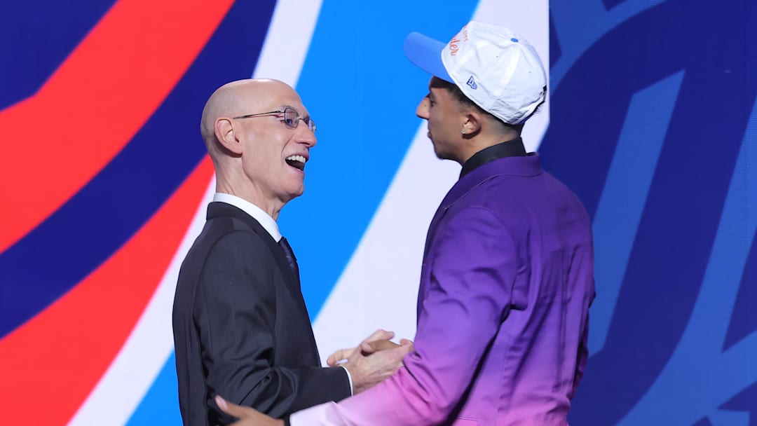 Jun 25, 2025; Brooklyn, NY, USA;  Nique Clifford greets NBA commissioner Adam Silver after being selected as the 24th pick by the Oklahoma City Thunder in the first round of the 2025 NBA Draft at Barclays Center. Mandatory Credit: Brad Penner-Imagn Images