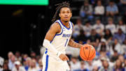 Memphis Tigers guard Dug McDaniel (1) handles the ball