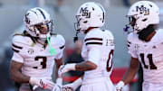 Mississippi State Bulldogs wide receiver Anthony Evans III (3) celebrates after scoring a touchdown during the third quarter against the Arkansas Razorbacks at Donald W. Reynolds Razorback Stadium. Bulldogs won 38-35.