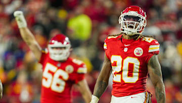 Nov 29, 2024; Kansas City, Missouri, USA; Kansas City Chiefs safety Justin Reid (20) and defensive end George Karlaftis (56) celebrate after a play during the second half against the Las Vegas Raiders at GEHA Field at Arrowhead Stadium. Mandatory Credit: Jay Biggerstaff-Imagn Images