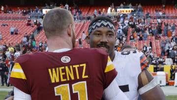 Jan 1, 2023; Landover, Maryland, USA; Washington Commanders quarterback Carson Wentz (11) hugs