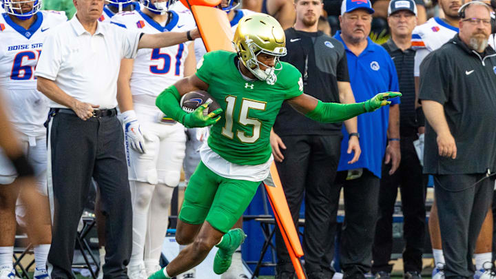 Oct 4, 2025; South Bend, Indiana, USA; Notre Dame Fighting Irish cornerback Leonard Moore (15) comes up with an interception against the Boise State Broncos at Notre Dame Stadium. Mandatory Credit: Michael Caterina-Imagn Images