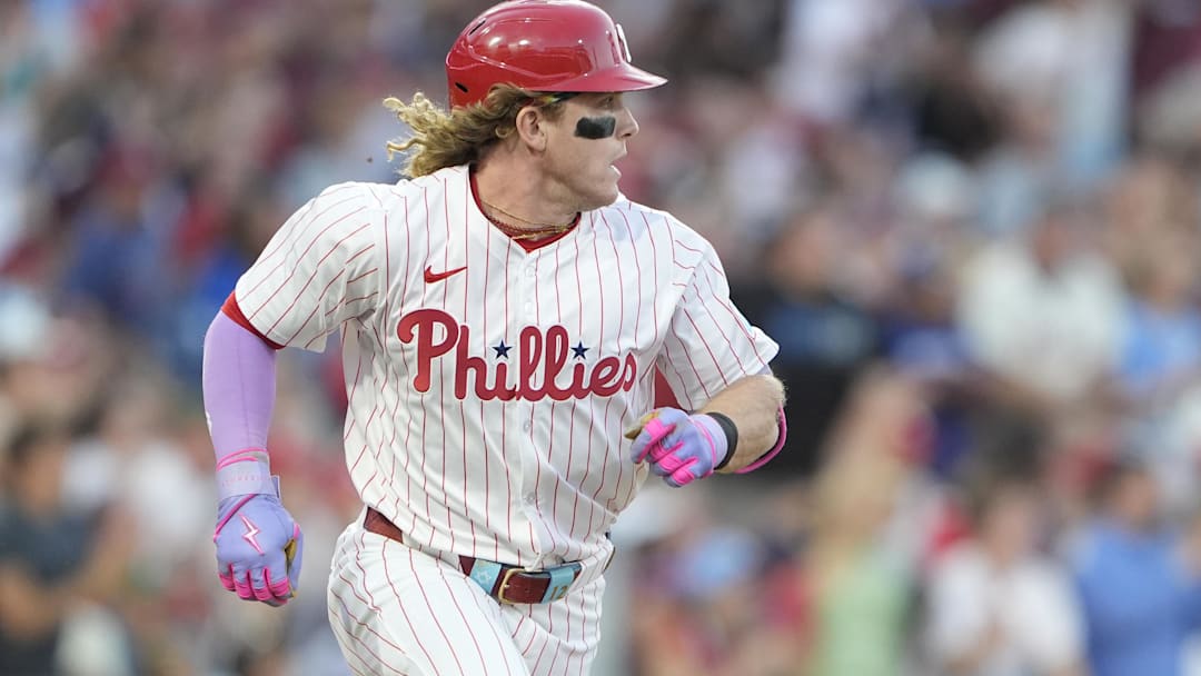 Aug 23, 2025; Philadelphia, Pennsylvania; Philadelphia Phillies left fielder Harrison Bader (2) runs out a single against the Washington Nationals during the fourth inning at Citizens Bank Park. 