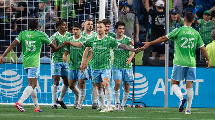 Jul 26, 2024; Seattle, Washington, USA;  Seattle Sounders including defender Jon Bell (15) midfielder Leo Chu (23), second from left, midfielder Obed Vargas (18), forward Jordan Morris (13), fourth from left, midfielder Albert Rusnak (11), forward Paul Rothrock (14) and defender Jackson Ragen (25) celebrate a goal against Minnesota United during the second half at Lumen Field. Mandatory Credit: Stephen Brashear-USA TODAY Sports