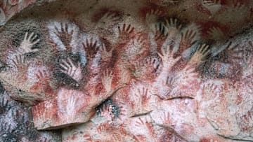 Stenciled human hands in a cave near Rio Pinturas, Argentina, dating from the last ice age.