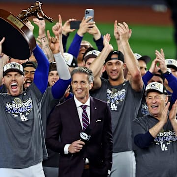 Oct 31, 2024; New York, USA, LAD; Los Angeles Dodgers first baseman Freddie Freeman (5) celebrates with the Willie Mays World Series Most Valuable Player Award after being name the MVP in game five to win the 2024 Imagn Images World Series against the New York Yankees at New York. Mandatory Credit: Wendell Cruz-Imagn Images