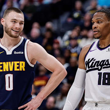Nov 3, 2025; Denver, Colorado, USA; Denver Nuggets guard Christian Braun (0) and Sacramento Kings guard Russell Westbrook (18) in the first quarter at Ball Arena. Mandatory Credit: Isaiah J. Downing-Imagn Images