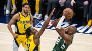 May 2, 2024; Indianapolis, Indiana, USA; Milwaukee Bucks forward Khris Middleton (22) shoots the ball while Indiana Pacers forward Aaron Nesmith (23)  defends during game six of the first round for the 2024 NBA playoffs at Gainbridge Fieldhouse. Mandatory Credit: Trevor Ruszkowski-USA TODAY Sports