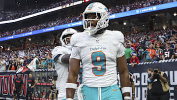 Dec 15, 2024; Houston, Texas, USA; Miami Dolphins tight end Jonnu Smith (9) reacts after a touchdown reception during the game against the Houston Texans at NRG Stadium. Mandatory Credit: Troy Taormina-Imagn Images