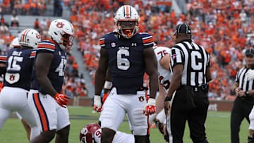 Sep 28, 2024; Auburn, Alabama, USA;  Auburn Tigers linebacker Austin Keys (6) reacts after tackling Oklahoma Sooners quarterback Michael Hawkins Jr. (9) during the first quarter at Jordan-Hare Stadium.
