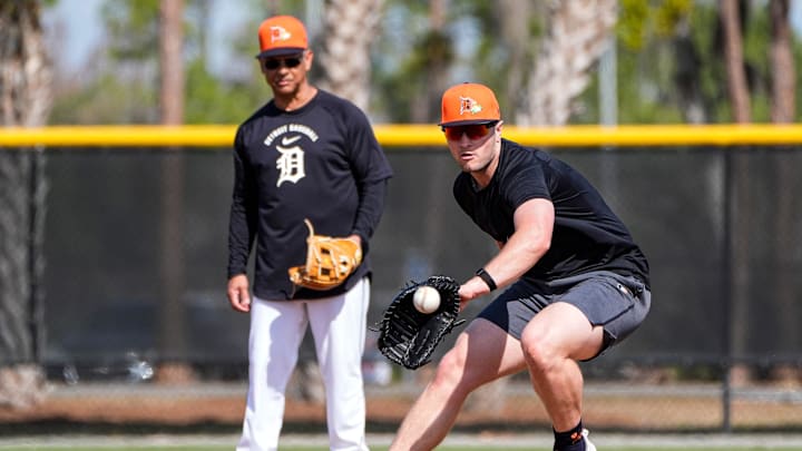 Detroit Tigers infielder Jace Jung practices as third base coach Joey Cora watches during spring training at TigerTown in Lakeland, Fla. on Saturday, Feb. 14, 2026.