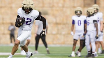 Washington's Carson Bruener (42) runs the ball during practice at SAC II in El Paso, Texas, on Friday, Dec. 27, 2024, as the team prepares for the Tony the Tiger Sun Bowl.