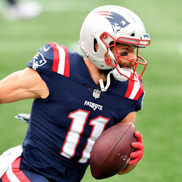 Oct 25, 2020; Foxborough, Massachusetts, USA; New England Patriots wide receiver Julian Edelman (11) runs with the ball during warmups before a game against the San Francisco 49ers at Gillette Stadium. Mandatory Credit: Brian Fluharty-Imagn Images