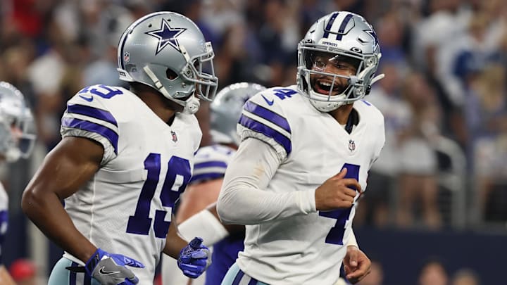 Arlington, Texas, USA; Dallas Cowboys quarterback Dak Prescott (4) celebrates with Dallas Cowboys wide receiver Amari Cooper (19).