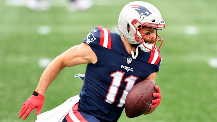 Oct 25, 2020; Foxborough, Massachusetts, USA; New England Patriots wide receiver Julian Edelman (11) runs with the ball during warmups before a game against the San Francisco 49ers at Gillette Stadium.