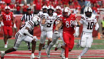 Sep 20, 2025; Salt Lake City, Utah, USA; Utah Utes tight end Dallen Bentley (88) runs after a catch against Texas Tech Red Raiders defensive back Dontae Balfour (20) and linebacker Jacob Rodriguez (10) during the fourth quarter at Rice-Eccles Stadium. Mandatory Credit: Rob Gray-Imagn Images