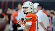 Nov 15, 2025; Miami Gardens, Florida, USA; Miami Hurricanes quarterback Carson Beck (11) warms up before the game against NC State Wolfpack at Hard Rock Stadium. Mandatory Credit: Sam Navarro-Imagn Images