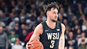 Jan 11, 2025; Spokane, Washington, USA; Washington State Cougars forward Ethan Price (3) controls the ball against the Gonzaga Bulldogs in the second half at McCarthey Athletic Center. Mandatory Credit: James Snook-Imagn Images