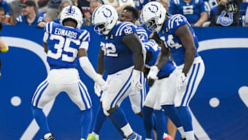 Aug 16, 2025; Indianapolis, Indiana, USA; Indianapolis Colts cornerback Johnathan Edwards (35), Indianapolis Colts defensive tackle Neville Gallimore (92) and Indianapolis Colts defensive end Durell Nchami (74) celebrate after forcing a turnover during the first half against the Green Bay Packers at Lucas Oil Stadium. Mandatory Credit: Robert Goddin-Imagn Images