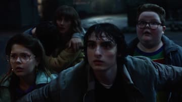 STRANGER THINGS. (L to R) Winona Ryder as Joyce Byers, Finn Wolfhard as Mike Wheeler and Jake Connelly as Derek in STRANGER THINGS. Cr. Courtesy of Netflix © 2025