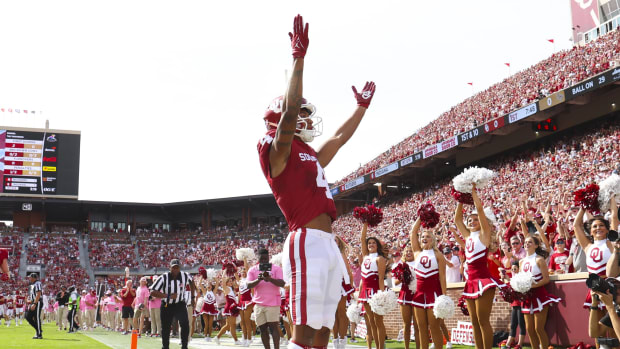 Oklahoma Sooners wide receiver Nic Anderson celebrates a touchdown in a college football game in the SEC.