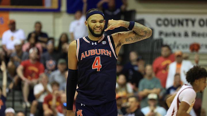 Nov 25, 2024; Lahaina, Hawaii, USA;  Auburn Tigers forward Johni Broome (4) reacts after scoring against the Iowa State Cyclones during the second half of an NCAA college basketball game at Lahaina Civic Center. Auburn defeated Iowa State 83-81. Mandatory Credit: Marco Garcia-Imagn Images