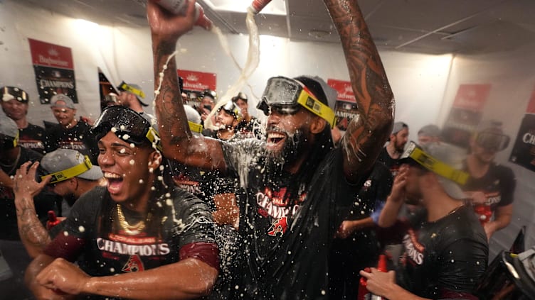 Oct 24, 2023; Philadelphia, PA, USA; Arizona Diamondbacks pitchers Miguel Castro, center, and Luis