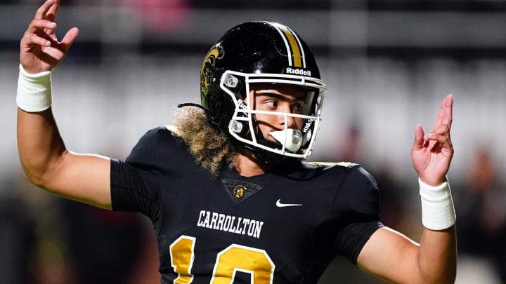 Carrollton, with USC bound quarterback Julian Lewis (10), takes to the field for the first time on Friday night when the Trojans face Woodward Academy in a nationally televised game on ESPN2. Get all the Friday night scores from SBLive Sports.