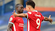 Roberto Firmino celebrating a Liverpool goal with Sadio Mane