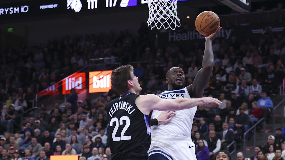 Jan 20, 2026; Salt Lake City, Utah, USA; Minnesota Timberwolves forward Julius Randle (30) goes to the basket against Utah Jazz forward Kyle Filipowski (22) during the second half at Delta Center. Mandatory Credit: Rob Gray-Imagn Images