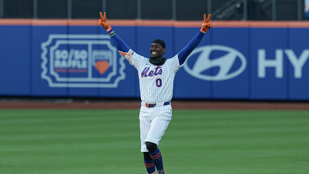 Apr 7, 2026; New York City, New York, USA;  New York Mets pinch hitter Ronny Mauricio (0) celebrates after hitting an RBI walk-off single during the tenth inning against the Arizona Diamondbacks at Citi Field. Mandatory Credit: Vincent Carchietta-Imagn Images