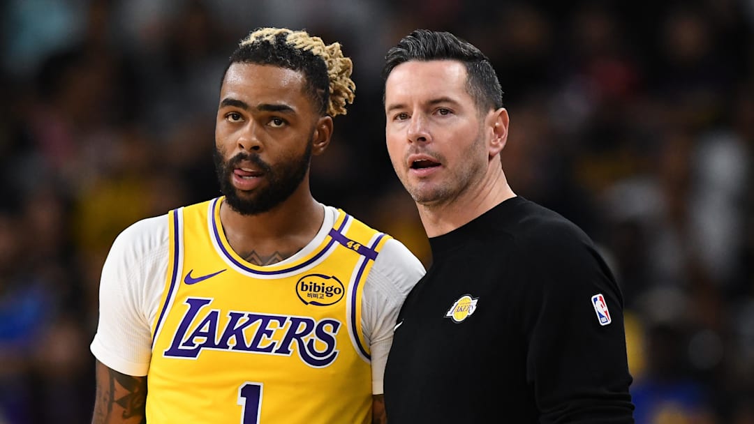 Oct 4, 2024; Palm Desert, California, USA; Los Angeles Lakers head coach JJ Redick talks to guard D'Angelo Russell (1) against the Minnesota Timberwolves during the first half at Acrisure Arena. Mandatory Credit: Jonathan Hui-Imagn Images