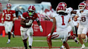 Nov 15, 2025; Tuscaloosa, Alabama, USA;  Alabama Crimson Tide running back Daniel Hill (4) runs the ball against Oklahoma Sooners defensive back Jaydan Hardy (1) during the first half at Saban Field at Bryant-Denny Stadium. Mandatory Credit: David Leong-Imagn Images