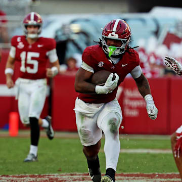 Nov 15, 2025; Tuscaloosa, Alabama, USA;  Alabama Crimson Tide running back Daniel Hill (4) runs the ball against Oklahoma Sooners defensive back Jaydan Hardy (1) during the first half at Saban Field at Bryant-Denny Stadium. Mandatory Credit: David Leong-Imagn Images