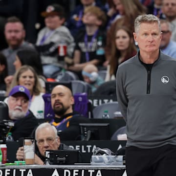 Golden State Warriors head coach Kerr watches his team from the sidelines during the second half against the Utah Jazz at Delta Center. 