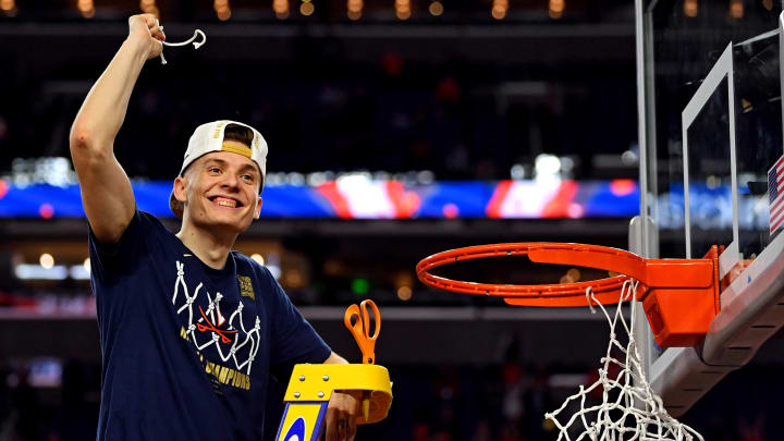 Apr 8, 2019; Minneapolis, MN, USA; Virginia Cavaliers guard Kyle Guy (5) cuts down the net after beating the Texas Tech Red Raiders in the championship game of the 2019 men's Final Four at US Bank Stadium. Mandatory Credit: Bob Donnan-USA TODAY Sports