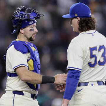 Jun 2, 2024; Seattle, Washington, USA; Seattle Mariners catcher Cal Raleigh (29) greets Seattle Mariners pitcher Mike Baumann (53) after the final out of the game against the Los Angeles Angels at T-Mobile Park. Mandatory Credit: John Froschauer-USA TODAY Sports