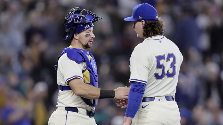 Jun 2, 2024; Seattle, Washington, USA; Seattle Mariners catcher Cal Raleigh (29) greets Seattle Mariners pitcher Mike Baumann (53) after the final out of the game against the Los Angeles Angels at T-Mobile Park. Mandatory Credit: John Froschauer-USA TODAY Sports