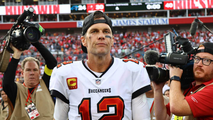 Jan 1, 2023; Tampa, Florida, USA; Tampa Bay Buccaneers quarterback Tom Brady (12) runs off the field after they beat the Carolina Panthers t Raymond James Stadium. Mandatory Credit: Kim Klement-USA TODAY Sports