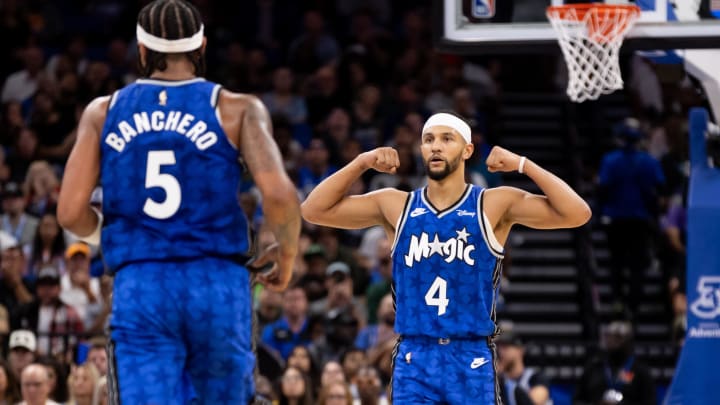 Nov 11, 2023; Orlando Magic guard Jalen Suggs (4) gestures towards Orlando Magic forward Paolo Banchero (5) during the first half against the Milwaukee Bucks.