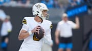 Nov 9, 2025; Charlotte, North Carolina, USA;  New Orleans Saints quarterback Tyler Shough (6) looks to pass during the second quarter against the Carolina Panthers at Bank of America Stadium. Mandatory Credit: Jim Dedmon-Imagn Images