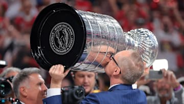 Jun 17, 2025; Sunrise, Florida, USA; Florida Panthers head coach Paul Maurice hoists the Stanley Cup after winning game six of the 2025 Stanley Cup Final against the Edmonton Oilers at Amerant Bank Arena. Mandatory Credit: Sam Navarro-Imagn Images