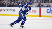 Dec 12, 2024; Toronto, Ontario, CAN; Toronto Maple Leafs forward Auston Matthews (34) shoots the puck against the Anaheim Ducks during the third period at Scotiabank Arena. Mandatory Credit: John E. Sokolowski-Imagn Images