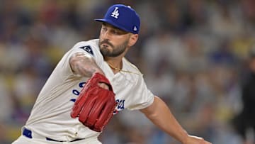 Sep 17, 2025; Los Angeles, California, USA;  Los Angeles Dodgers relief pitcher Tanner Scott (66) earns a save in the ninth inning against the Philadelphia Phillies at Dodger Stadium. Mandatory Credit: Jayne Kamin-Oncea-Imagn Images